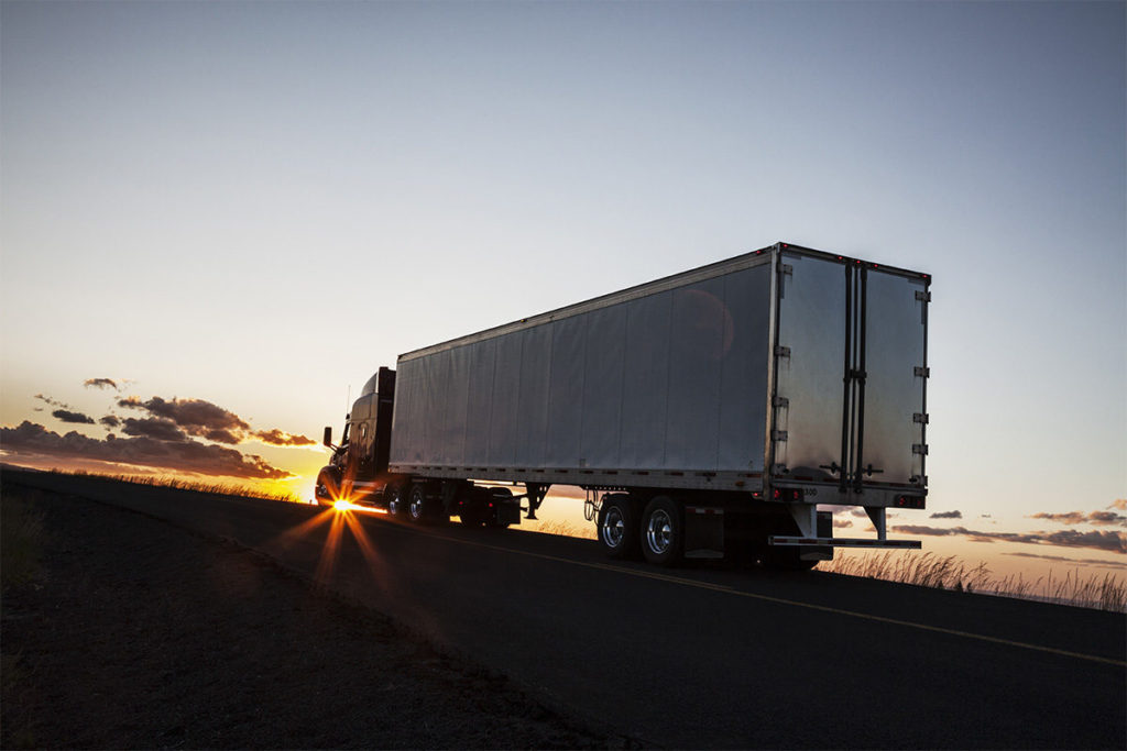 truck driving blue horizon